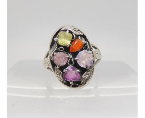 A white metal gem set ring in the style of Bernard Instone, size K1/2, weight 3.2gms Condition Report:Available upon request