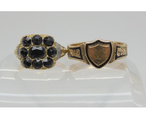 Two mourning rings, a 10ct gold signet ring with black enamel, with hair inlay and panels spelling out 'Father' with inscript