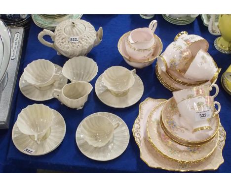 A Tuscan pink ground teaset with gilt and coloured enamel floral decoration, together with Belleek shell shaped teawares Cond