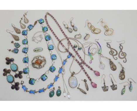 A box full of silver and costume jewellery to include a pair of rainbow titanium earrings, a pair of silver Iona viking longs