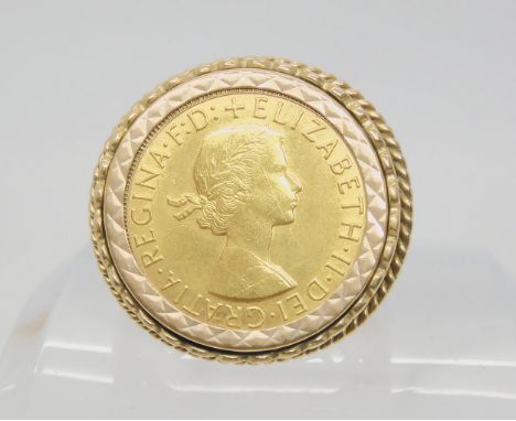 A 1964 full gold sovereign, in a 9ct gold ring mount. Gents finger size 2 1/2, weight 17.1gms Condition Report:Available upon