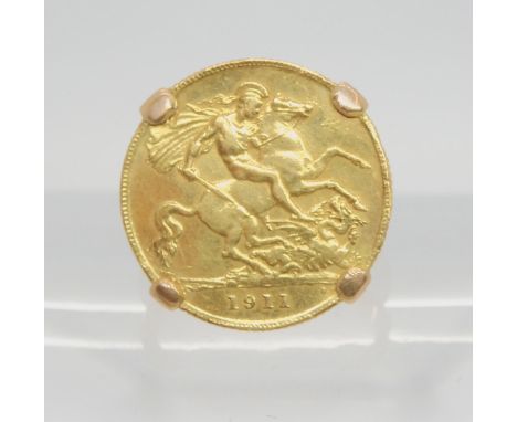 A 1911 gold half sovereign, in a yellow metal ring mount, size N, weight 8gms Condition Report:Available upon request