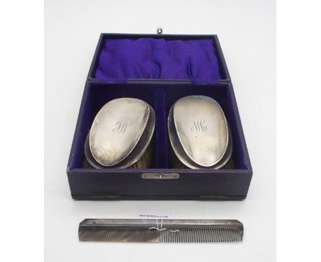 A cased set of George V silver brushes and a comb, makers mark rubbed, Birmingham 1291 Condition Report:Available upon reques