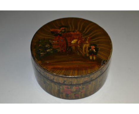 A late 18th century French vernis Martin circular snuff box, the cover decorated with wagoners conveying the grape harvest, 8