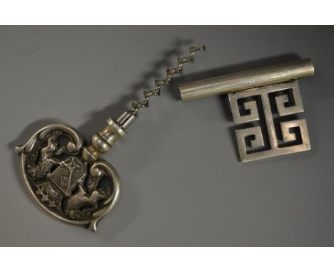 A silver-plated novelty travelling corkscrew, as a key, the handle with a coat of arms, 13cm long