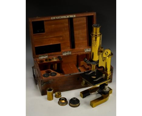 A Reichert monocular microscope, cased, lacquered brass and enamelled steel, 25cm tall, fully rack-and-pinion adjustable hors