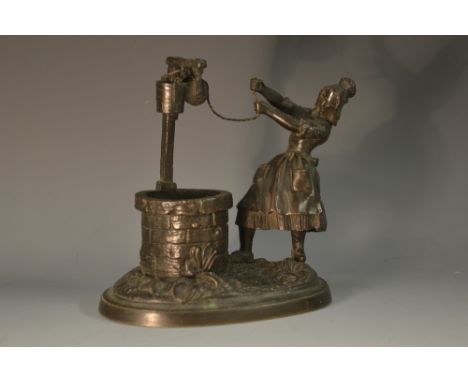 French School (19th century), a dark patinated bronze, Drawing Water, a young girl at a well, oval base, 14cm wide