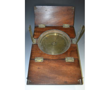 A large 19th century mahogany navigation compass, 17cm register, the case with twin-hinged covers, 47cm wide (open)   Conditi