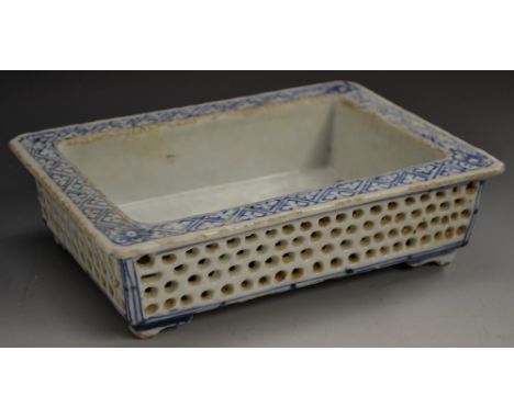 A Chinese porcelain scholar's table-top bonsai trough, broad rim decorated in underglaze blue with prunus blossom and trellis