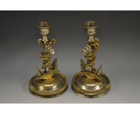 A pair of late 19th century gilt and silvered novelty candlesticks, as ships' anchors, domed bases with ropetwist borders, mo
