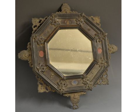 A 19th century Italian bronze and specimen marble mounted octagonal looking glass, the moulded border set with lapis lazuli a