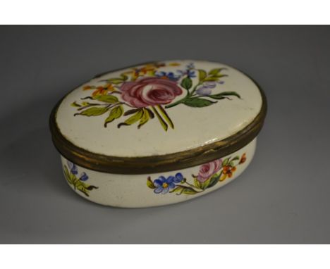 A George III South Staffordshire enamel oval snuff box, hinged cover, painted overall with colourful summer flowers, 6.5cm wi