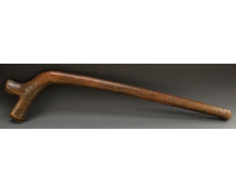 Tribal Art - a Fijian gata waka 'gunstock club', typically curved with spur to head, 92cm long, 19th century, collector's ini