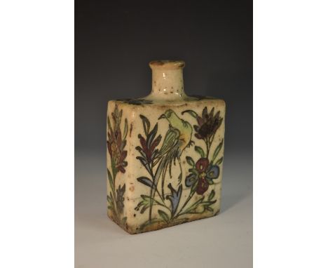 A Middle Eastern pottery rectangular flask, painted in the Iznik palette with stylised flowers, 16cm high