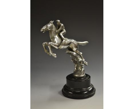 Automobilia - an early 20th century chrome plated novelty car mascot, as a horse and jockey jumping a fence, marked Desmo, 14