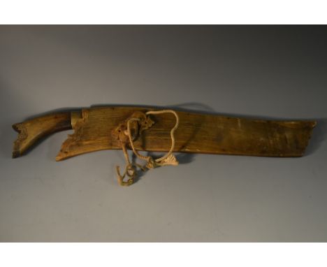 An Indonesian dagger, 30cm broad single-edged blade, kris type handle, horn scabbard, 41cm long overall, 19th century   Condi