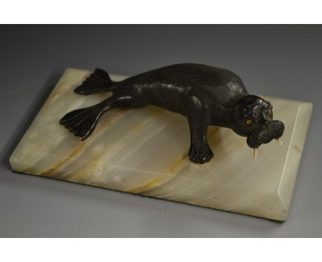 Continental School (early 20th century), a dark patinated bronze, of a Walrus, rectangular onyx base, 17cm wide