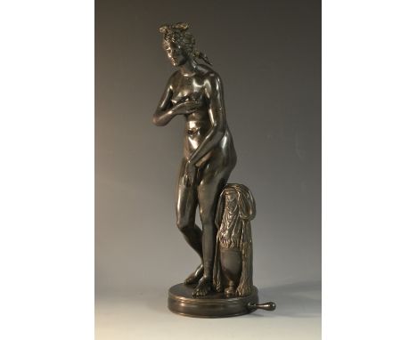 Italian Grand Tour School (18th/19th century), a dark patinated bronze, of the nude Venus beside an urn, circular connoisseur