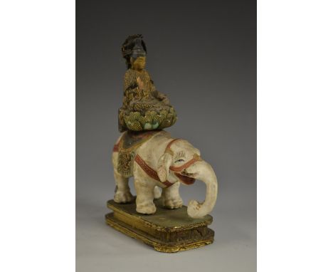 An Indo-Chinese/Tibetan polychrome painted softwood and gesso model, of Buddha on an elephant, lotus howdah, 11.5cm high, 19t