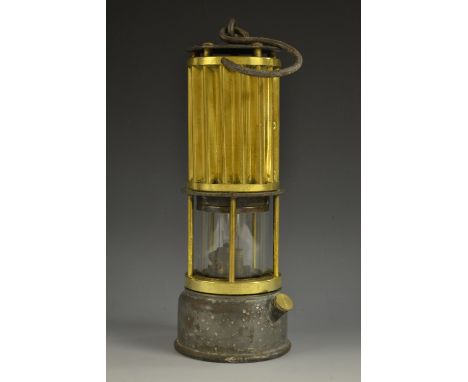 Mining - an early 20th century miner's lamp, by The Automobile Palace, Llandrindon Wells, ribbed brass canopy, glass chamber,