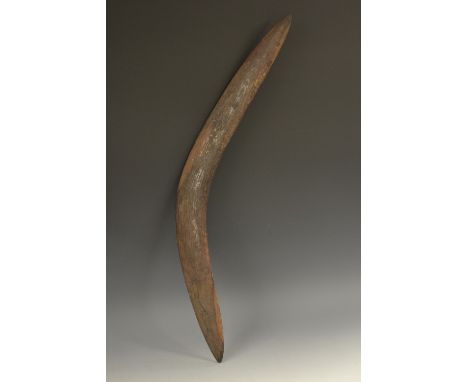 Tribal Art - an Australian Aboriginal boomerang, wavy stone carved texture, 68cm long, 19th/early 20th century