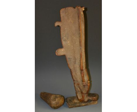 Tribal Art - an African bone pestle and 'mortar', formed from the leg of a substantial mammal, 42cm long, 19th century 
