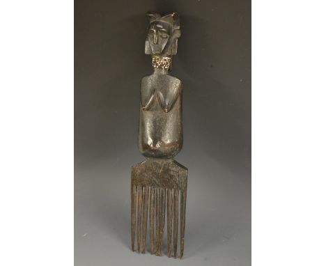Tribal Art - a Nyanwezi comb, carved with a female fertility figure wearing a beadwork necklace, 34cm long, Bantu, Tanzania