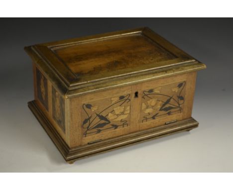 A German Art Nouveau mahogany, marquetry and pyrography table box, by Hermann Loose, Hamburg, hinged cover enclosing twin com