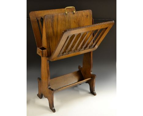 An Edwardian gentleman's oak library combination canterbury, the sides with hinged fretwork divisions for sheet music, period