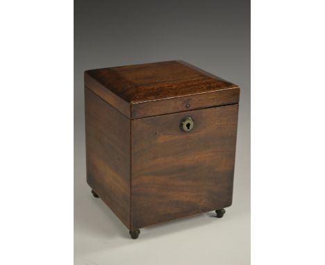 An unusual George IV mahogany square Campaign-type caddy or box, hinged chamfered cover enclosing a lift-out tray with four z