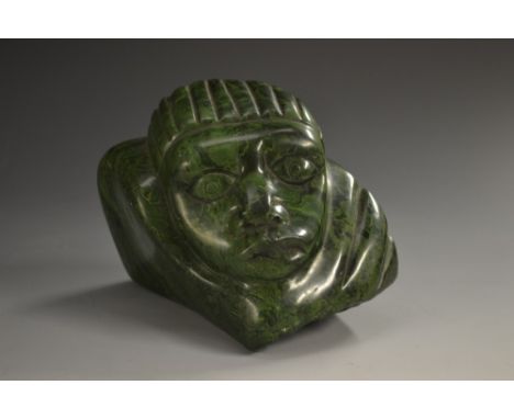 An African malachite 'boulder' carving, of a stylised face, 8.5cm high, probably Congo region 