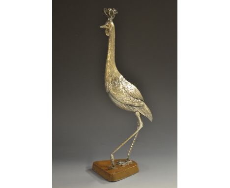 An Oriental silvered model, of an exotic ho-ho bird, mahogany base, 32cm high    Condition Report:  generally good, silver ru