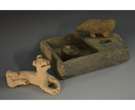 Antiquities - a Chinese terracotta model, of a recumbent hound, applied and incised anatomical detailing, 13cm long, MS label
