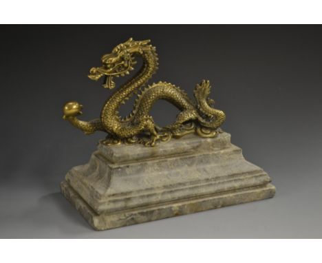 Chinese School (19th century), a gilt bronze, of a dragon chasing a flaming pearl, stepped marble base, 18cm wide   Condition