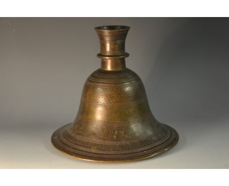 An Islamic bronze bell shaped hookah base, chased with a band of scrolling leafy branches, 16cm high, 19th century