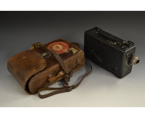 A Kodak Ciné Camera Model b, K: A. f l. 9, brown bridle leather carrying case en suite, luggage label Cunard White Star First