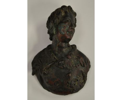 Antiquities - a Roman verdigris patinated bronze mount, possibly from a piece of furniture, as a bust of a young man, wavy ha