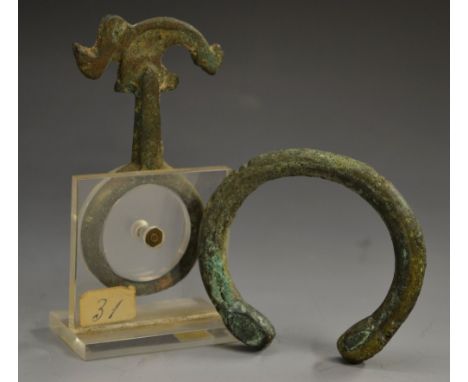 Antiquities - an Ancient verdigris patinated bronze ring harness, probably Luristan, the shaped scroll cresting cast in relie