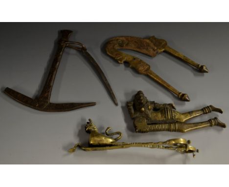 A pair of 19th century Indian brass betel nut cutters, cast as a reclining deity, steel blade, 13cm long; others, scales; snu