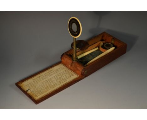 A George III mahogany withering folding pocket microscope, The Botanic Microscope, ivory eyepiece and stage, bone hafted impl