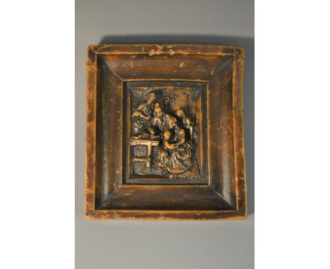 A 19th century wax picture, moulded after an Old Master with a domestic scene, 9.5cm x 8.5cm