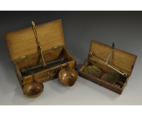 A set of 19th century brass and copper travelling balance scales, the beam 18cm wide; another, similar (2)