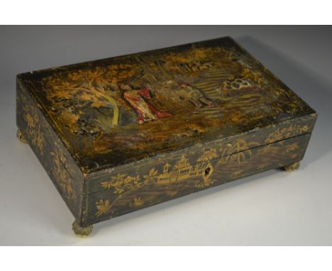 A Regency japanned rectangular playing card box, decorated in the Chinoiserie taste with a Chinese official and his attendant