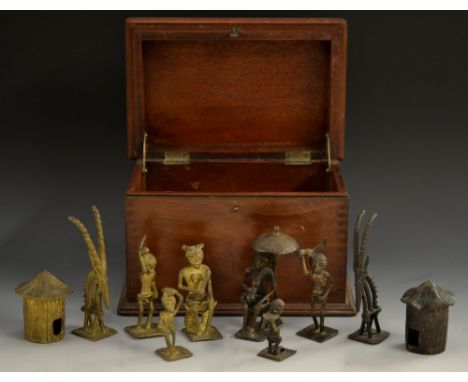 An unusual Benin Bronze chess set, dark patinated with gilt opposition, the Kings 10cm high, Nigeria   Condition Report:  app