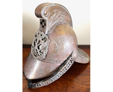 MODERN REPRODUCTION COPY OF AN ANTIQUE FIREMAN'S HELMET, CIRCA 1900