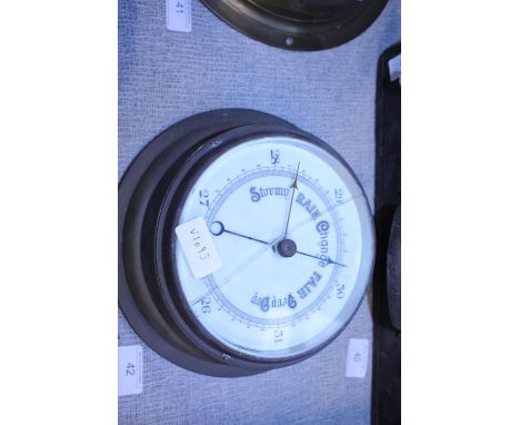 A brass cased barometer (with crack to glass) 