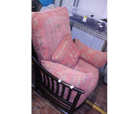 A vintage Ercol armchair. With spindle back.  Postage unavailable 