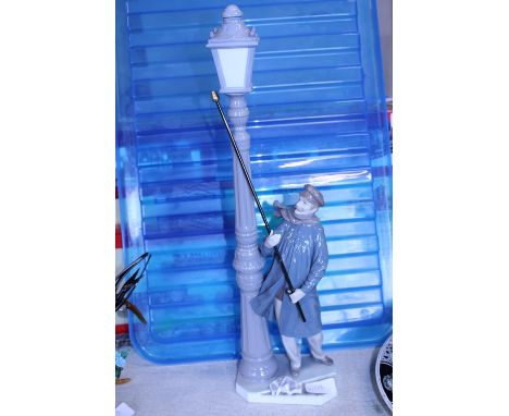A Lladro lamp lighter figure 