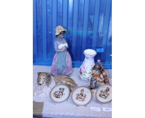 A selection of assorted collectables including Nao and Geobel figures 