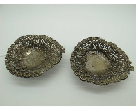 Two Hallmarked Silver Heart Shape Trinket Dishes, (damages) of pierced dsign on ball feet. (2) [696323]